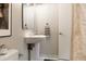 Powder room with pedestal sink, modern fixtures and decor at 1440 Little Raven St # 107, Denver, CO 80202