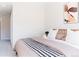 Cozy bedroom showcasing a modern bed frame, decorative pillows, and stylish blanket at 1440 Little Raven St # 107, Denver, CO 80202