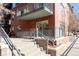 Building exterior featuring brick, balconies, and access stairs, highlighting architectural features at 1440 Little Raven St # 107, Denver, CO 80202