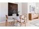 Modern dining area with round white table, stylish chairs, and elegant decor at 1440 Little Raven St # 107, Denver, CO 80202