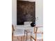 Dining room with round white table, stylish chairs, modern light, and artwork at 1440 Little Raven St # 107, Denver, CO 80202