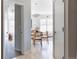 Dining area and hallway with an open-concept layout and abundant natural light at 1440 Little Raven St # 107, Denver, CO 80202