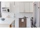 Contemporary kitchen with stainless steel appliances, white cabinets, and sleek countertops at 1440 Little Raven St # 107, Denver, CO 80202