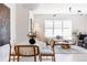 Inviting living area with stylish dining set, comfortable seating, and bright natural light at 1440 Little Raven St # 107, Denver, CO 80202