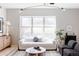 Bright living room with oversized window, comfortable seating, and stylish decor at 1440 Little Raven St # 107, Denver, CO 80202