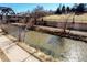 Picturesque river view showcasing landscaping, trees, and architectural elements of the nearby area at 1440 Little Raven St # 107, Denver, CO 80202