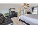 Relaxing bedroom with a dresser, and walk-in closet featuring a ceiling fan at 9113 E 36Th Ave, Denver, CO 80238