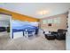 Spacious bonus room with ample space for activities and comfortable seating at 9113 E 36Th Ave, Denver, CO 80238