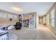 Bonus room with an abundance of natural light and built in shelving and cabinetry at 9113 E 36Th Ave, Denver, CO 80238