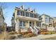 Attractive two-story home featuring a covered porch, detailed trim, and well-maintained yard at 9113 E 36Th Ave, Denver, CO 80238