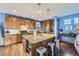Modern kitchen with stainless steel appliances, a large island, and custom cabinetry at 9113 E 36Th Ave, Denver, CO 80238