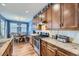 Well-equipped kitchen with ample cabinet space, stainless steel appliances, and breakfast area at 9113 E 36Th Ave, Denver, CO 80238