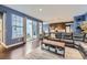 Open-concept living room with modern finishes, hardwood floors, and ample natural light at 9113 E 36Th Ave, Denver, CO 80238