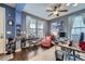 Bright office with a comfortable red chaise lounge, modern decor, and natural light at 9113 E 36Th Ave, Denver, CO 80238