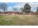 Large grassy backyard with mature trees and a patio providing ample space for outdoor activities at 6576 S Lincoln St, Centennial, CO 80121