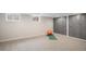 Versatile basement space with carpet flooring, closet storage, and natural light from the egress windows at 6576 S Lincoln St, Centennial, CO 80121