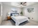 Bright bedroom with a comfortable bed, ceiling fan, and two windows providing plenty of natural light at 6576 S Lincoln St, Centennial, CO 80121