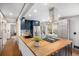 Modern kitchen featuring butcher block countertops, stainless steel appliances, and ample cabinet space at 6576 S Lincoln St, Centennial, CO 80121