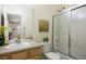 Cozy bathroom featuring a shower and tub combo, light wood vanity and neutral finishes at 6702 S Winnipeg Cir # 101, Aurora, CO 80016