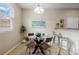 Bright dining room with table and chairs and lots of light at 6702 S Winnipeg Cir # 101, Aurora, CO 80016