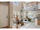 Inviting living area with high ceilings, featuring a staircase and seamless flow to the dining space at 6702 S Winnipeg Cir # 101, Aurora, CO 80016