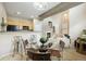 The open-concept living area boasts a cozy breakfast bar, fireplace, and comfortable seating at 6702 S Winnipeg Cir # 101, Aurora, CO 80016