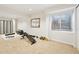 Clean basement with carpet, a mirror and exercise equipment at 9265 Buttonhill Ct, Highlands Ranch, CO 80130
