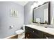Bathroom boasts a stylish vanity with ample storage, granite counters and modern fixtures at 9265 Buttonhill Ct, Highlands Ranch, CO 80130