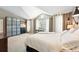 Cozy bedroom with large windows for natural light, plenty of storage and closet space at 9265 Buttonhill Ct, Highlands Ranch, CO 80130