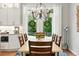Dining room with a chandelier, and direct access to a modern and spacious kitchen at 9265 Buttonhill Ct, Highlands Ranch, CO 80130