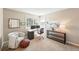 Comfortable home office setup with large windows, modern furniture, and ample natural light at 9265 Buttonhill Ct, Highlands Ranch, CO 80130