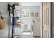 Bright laundry room features shelving, washer, and dryer for convenience and organization at 9265 Buttonhill Ct, Highlands Ranch, CO 80130