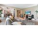 Spacious living room with kitchen view, creating an inviting atmosphere for gatherings at 9265 Buttonhill Ct, Highlands Ranch, CO 80130