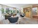 Open-concept living room with access to backyard, natural light, and seamless transition to the kitchen at 9265 Buttonhill Ct, Highlands Ranch, CO 80130