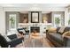 Cozy living room featuring a fireplace, recessed lighting, and comfortable seating arrangement at 9265 Buttonhill Ct, Highlands Ranch, CO 80130