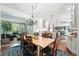 Open concept living area with direct access to the kitchen and dining room at 9265 Buttonhill Ct, Highlands Ranch, CO 80130