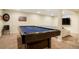 Finished basement with a pool table, carpet, neutral walls, and a sectional sofa at 2964 S Akron St, Denver, CO 80231