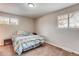 Cozy bedroom with carpet flooring, natural light, and neutral paint at 2964 S Akron St, Denver, CO 80231