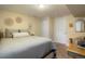 Cozy bedroom features plush carpeting, neutral walls, and a comfortable bed with decorative pillows at 2964 S Akron St, Denver, CO 80231