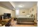 Comfortable bedroom with a neutral color scheme, featuring a desk setup, and comfortable bed at 2964 S Akron St, Denver, CO 80231