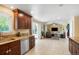 Bright kitchen area offering stainless appliances and an open layout to the living room at 2964 S Akron St, Denver, CO 80231
