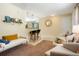 Cozy living room showcases tile floors, a breakfast bar, and comfortable seating arrangement at 2964 S Akron St, Denver, CO 80231