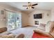 Bright living room with vaulted ceilings, slider to back patio, comfortable seating, and media center at 2964 S Akron St, Denver, CO 80231