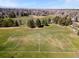 Aerial view of a well-maintained soccer field with a lush green playing surface at 2964 S Akron St, Denver, CO 80231