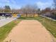 Aerial view of a sand volleyball court, a pool, mature landscaping, and other outdoor amenities at 2964 S Akron St, Denver, CO 80231