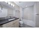 Clean bathroom with single vanity and bathtub at 1810 Julian St # 105, Denver, CO 80204