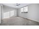 Well-lit bedroom featuring a ceiling fan and carpeted floor at 1810 Julian St # 105, Denver, CO 80204