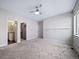 Spacious bedroom with ample closet space and carpet flooring at 1810 Julian St # 105, Denver, CO 80204