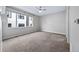 Bright and airy bedroom with large window and ceiling fan at 1810 Julian St # 105, Denver, CO 80204