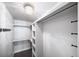 Large walk-in closet with shelves and hanging rods at 1810 Julian St # 105, Denver, CO 80204